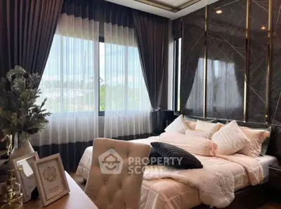 Luxurious bedroom with elegant decor and large window view