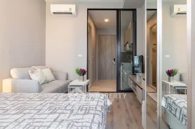 Modern studio apartment with cozy living area and stylish decor