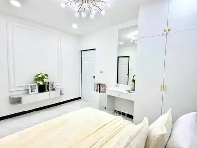 Elegant bedroom with modern decor and ample storage space