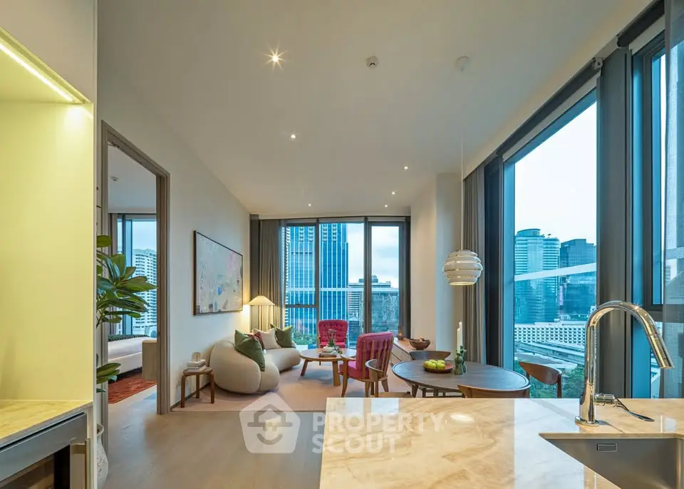 Luxurious modern living room with city view, open layout, and elegant furnishings.