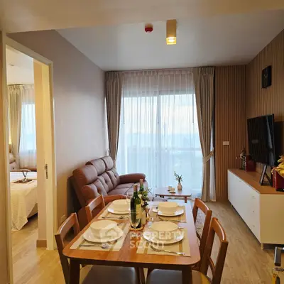 Modern open-plan living and dining area with cozy decor and natural light