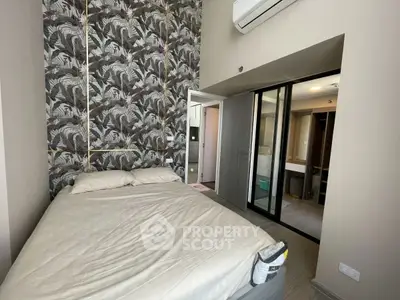 Modern bedroom with stylish wallpaper and ensuite bathroom in luxury apartment