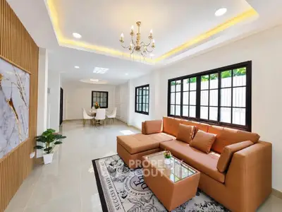 Luxurious living room with elegant chandelier and spacious seating area