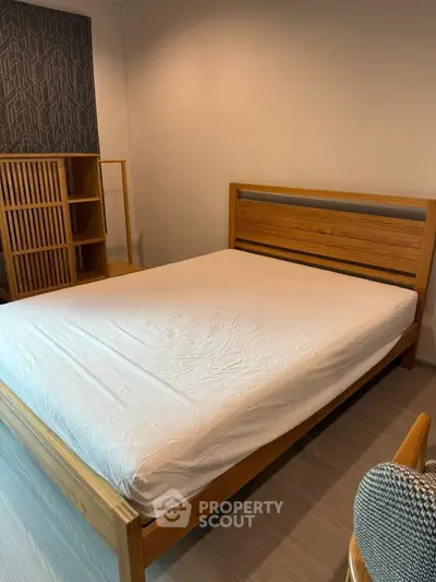 Spacious bedroom with modern wooden bed and stylish decor