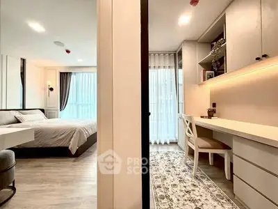 Modern bedroom and study area with elegant decor and natural light