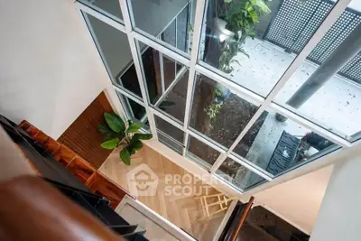 Stunning modern interior with large windows and elegant flooring