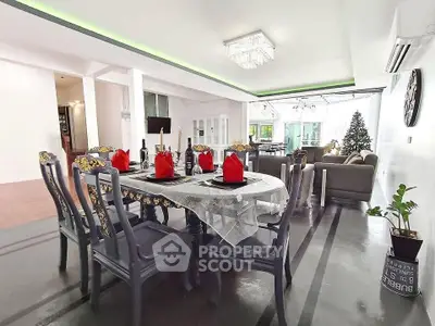 Spacious open-plan living and dining area with elegant decor and natural light.