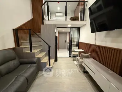 Modern duplex living room with sleek design and mezzanine level