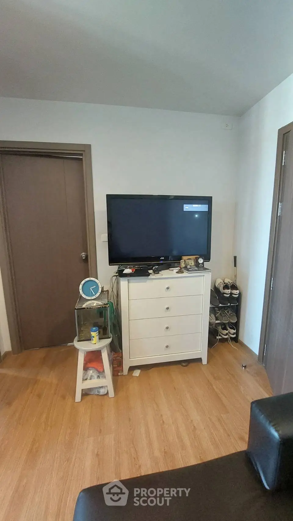 Cozy living room corner with TV and storage cabinet