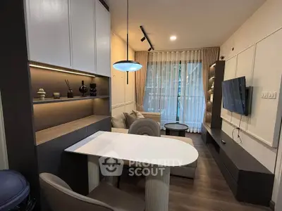 Modern living room with stylish furniture and large window view
