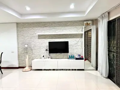 Modern living room with sleek TV setup and stylish decor