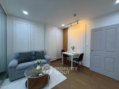 Modern living room with cozy sofa and dining area in stylish apartment