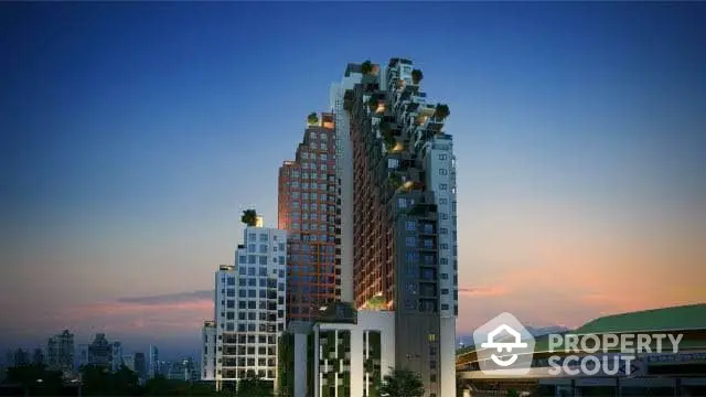 Stunning modern high-rise building with unique architectural design at sunset.