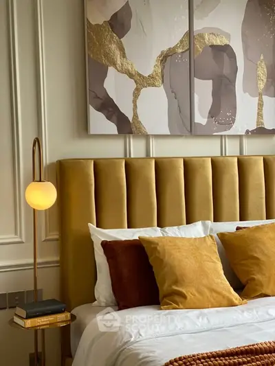Luxurious bedroom with plush velvet headboard and elegant decor