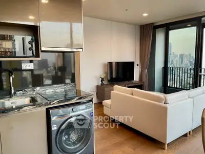 Modern living room with open kitchen and city view balcony