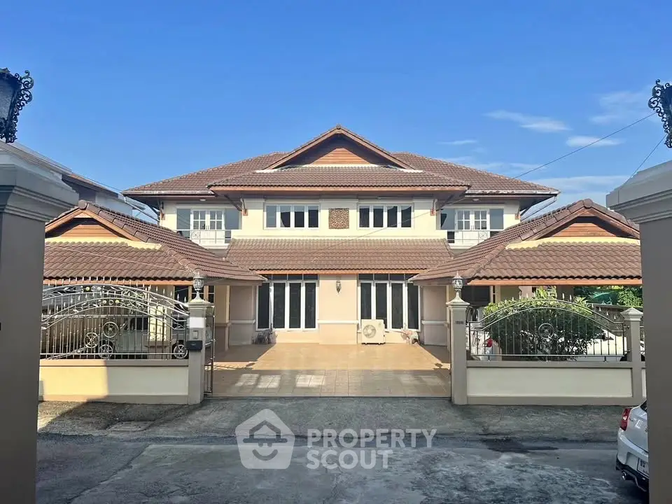 Stunning two-story house with spacious driveway and elegant architecture.