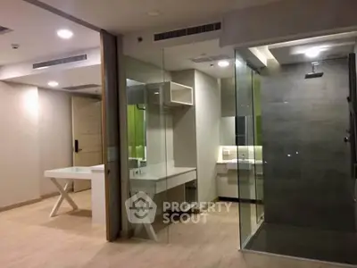 Modern interior with glass shower and sleek design, perfect for urban living.