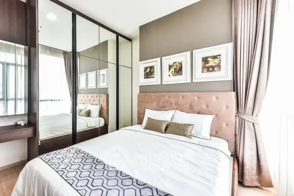 Elegant bedroom with mirrored wardrobe and stylish decor