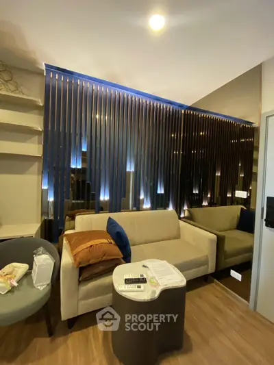 Modern living room with stylish lighting and cozy seating area