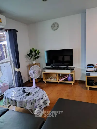 Cozy living room with modern decor and entertainment setup