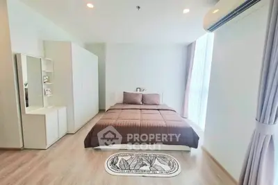 Spacious modern bedroom with natural light and minimalist decor
