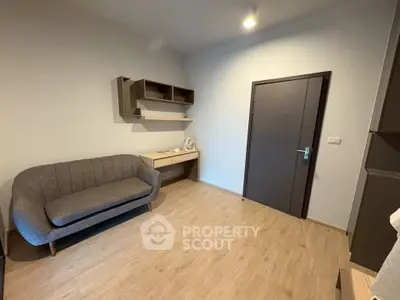 Modern minimalist living room with sleek furniture and wooden flooring