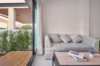 Modern living room with cozy sofa and garden view