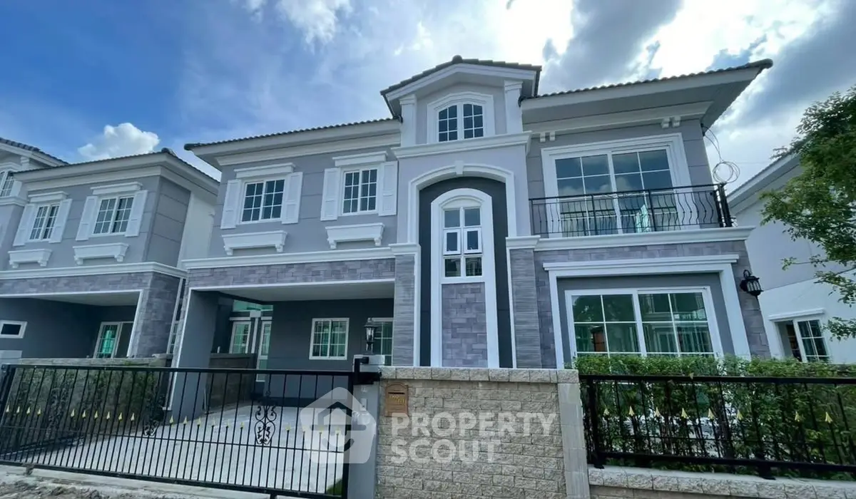 Stunning modern two-story house with elegant facade and spacious balcony