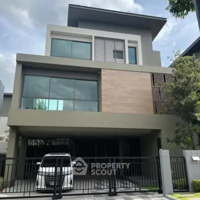 Modern three-story house with sleek design and spacious garage