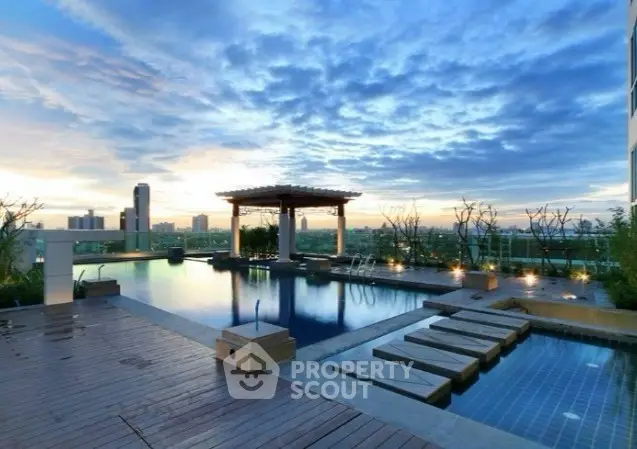 Luxurious rooftop pool with stunning city skyline views at sunset.