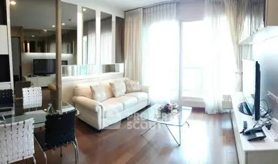 Elegant living room with modern decor and large windows for natural light