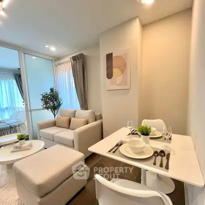 Modern living room with cozy dining area and stylish decor in a bright apartment.