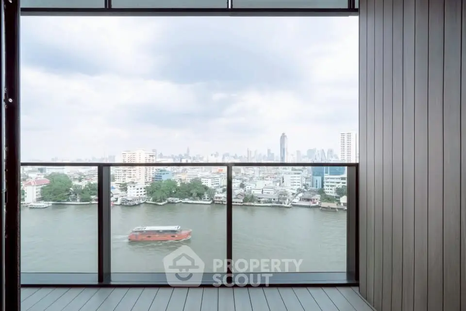 Stunning river view from a modern balcony in a high-rise apartment.