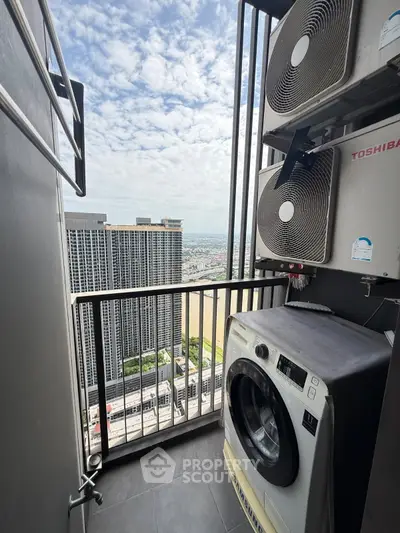 High-rise balcony with washing machine and city view, perfect for urban living.