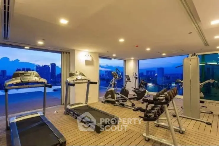 Spacious modern gym with state-of-the-art equipment and ambient lighting
