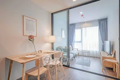 Modern open-plan living and dining area with stylish decor and natural light.