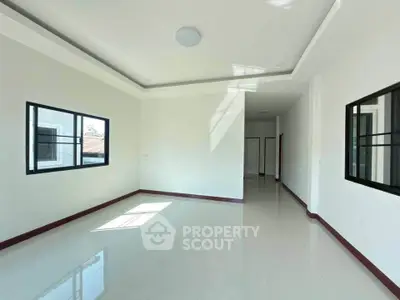 Spacious and bright interior with large windows and modern design, perfect for customization.