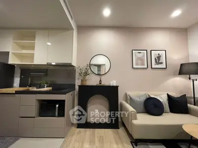 Modern living room with stylish kitchen and cozy seating area