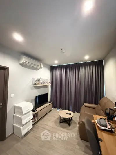 Modern living room with air conditioning and cozy seating area