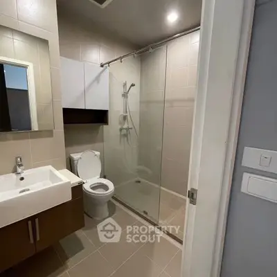 Modern bathroom with glass shower and sleek fixtures