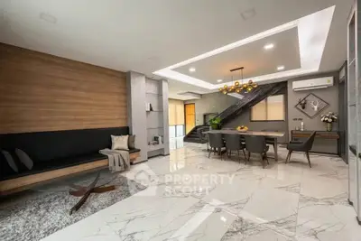 Luxurious modern living room with elegant dining area and stylish decor