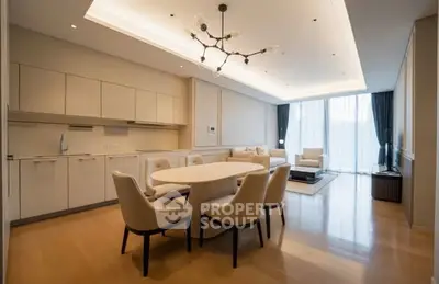 Luxurious open-plan living room with elegant dining area and modern lighting.