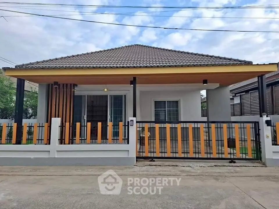 Charming single-story house with modern design and spacious front yard