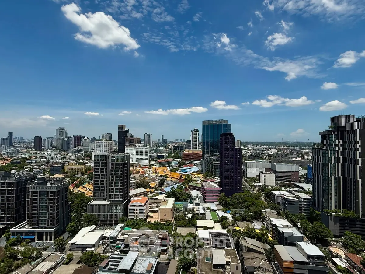 Stunning cityscape view showcasing modern skyscrapers under a clear blue sky, perfect for urban living.