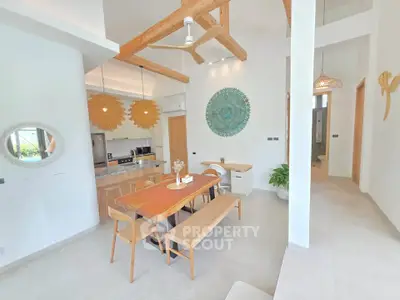 Stunning open-plan living and dining area with modern decor and natural light.