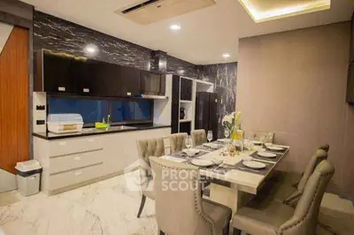 Luxurious modern kitchen with elegant dining area and sleek cabinetry