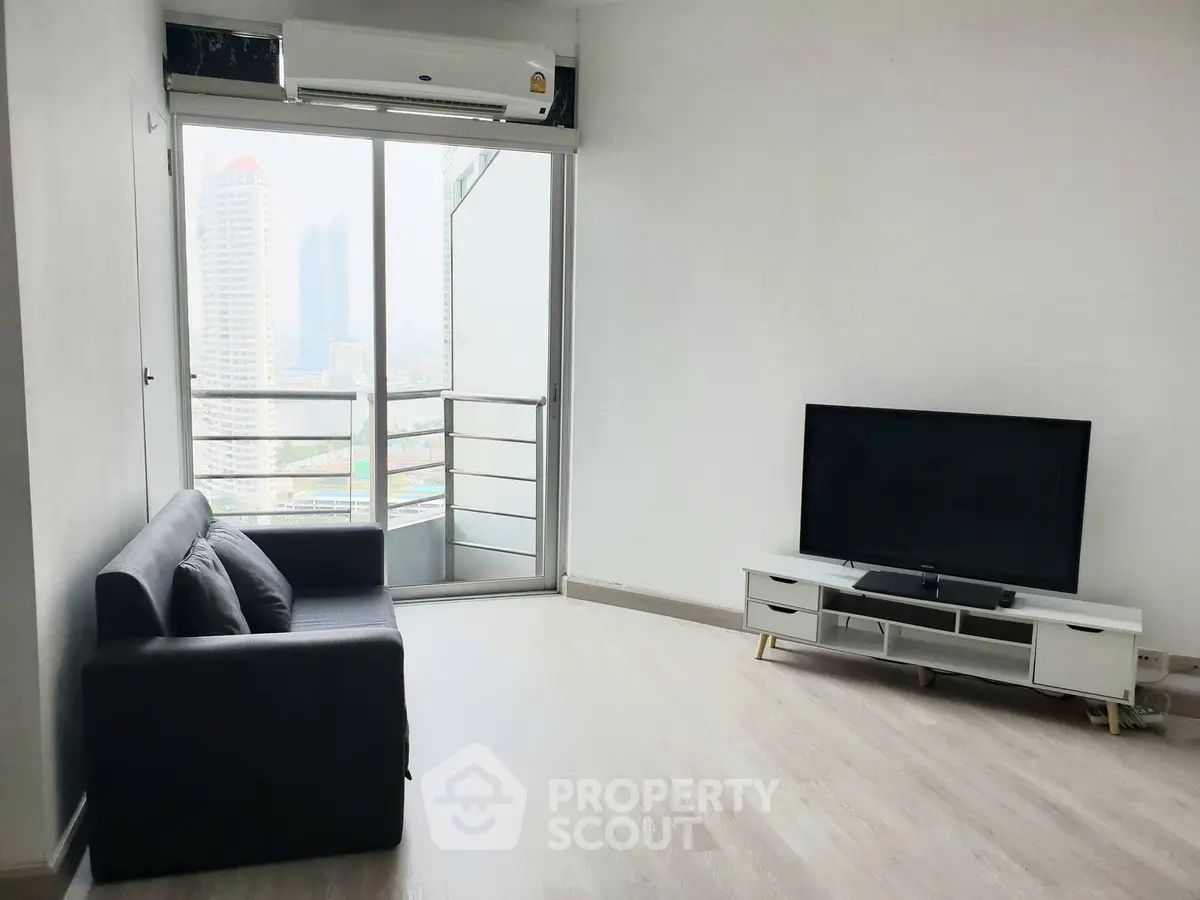 Modern living room with city view, featuring sleek sofa and large TV, ideal for urban living.