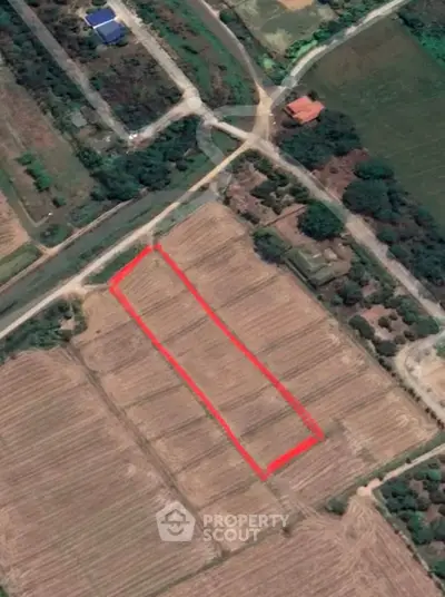 Aerial view of a marked plot of land in a rural area, ideal for development or agriculture.