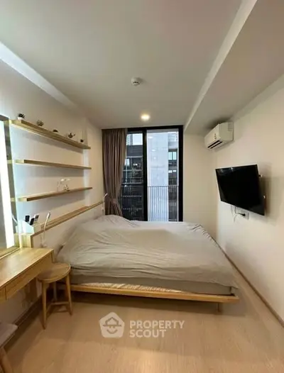 Cozy bedroom with modern decor and large window view