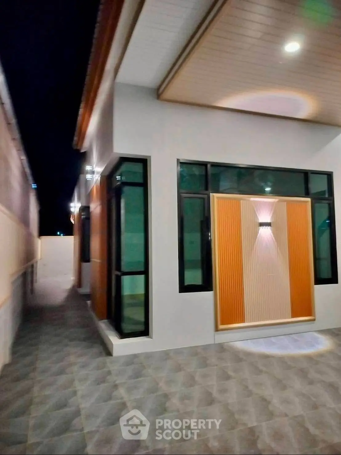 Modern exterior view of a stylish home with unique lighting and sleek design.